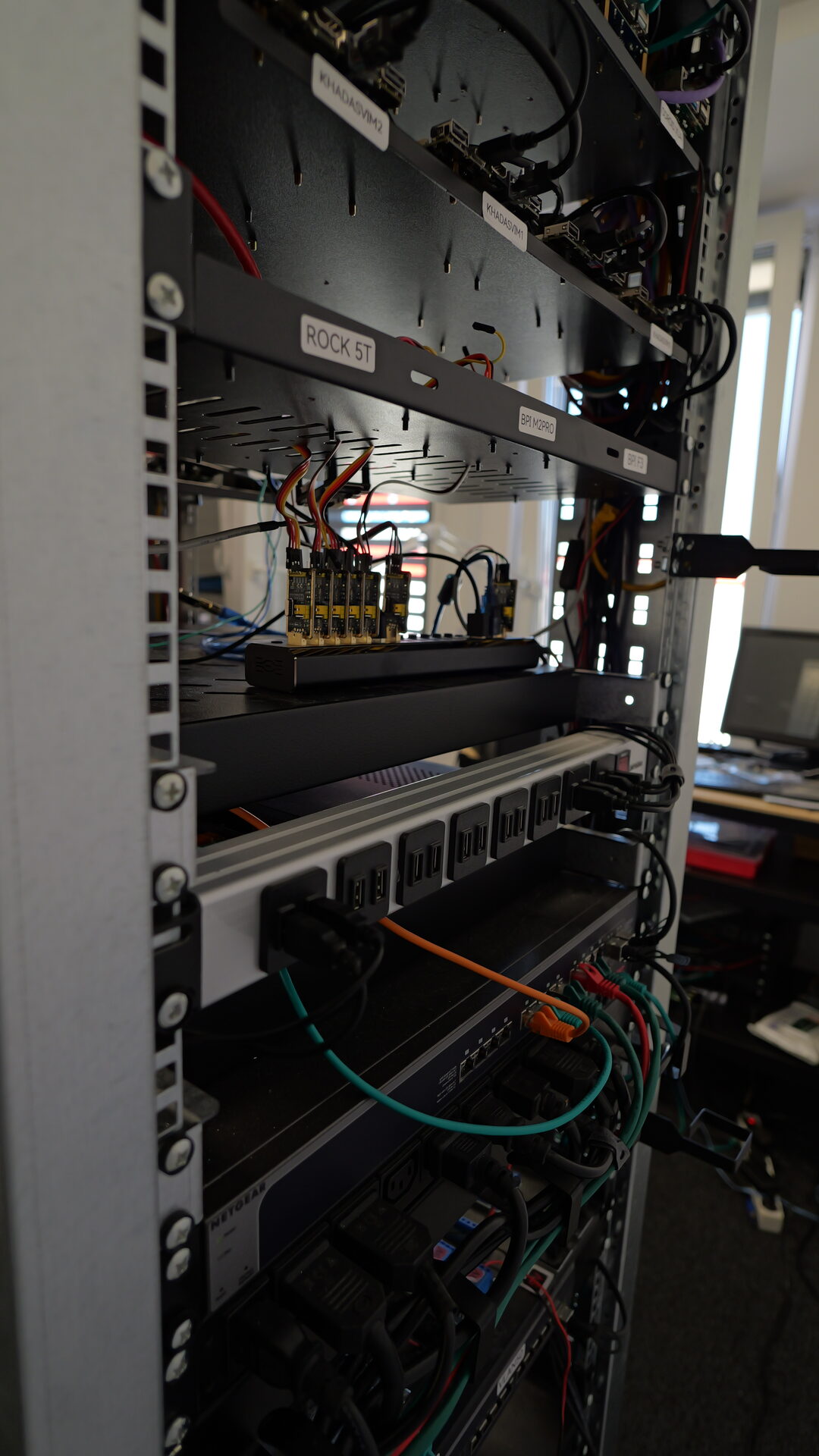 Boards shelf with the SD-card flasher bank and USB power hub