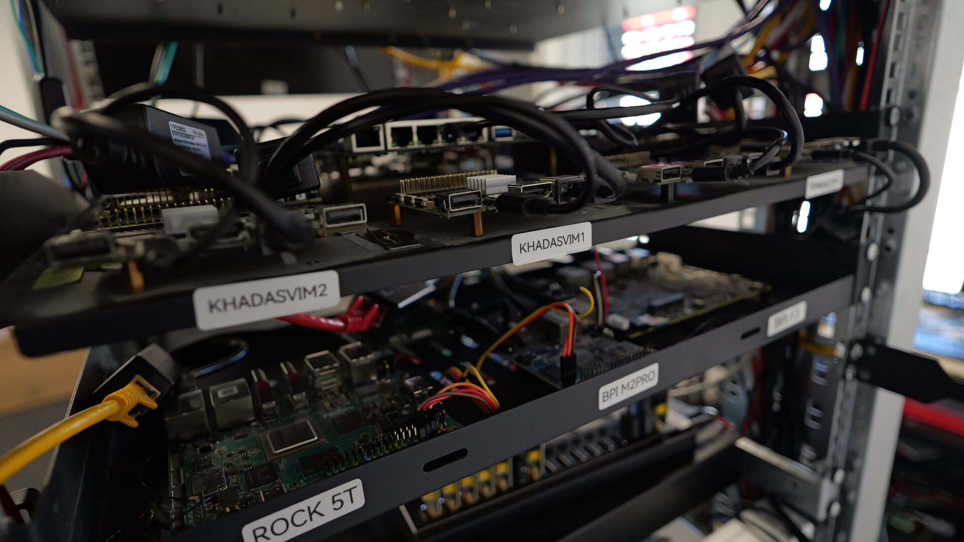 Close-up of labelled boards: Khadas VIM, ROCK 5T and BPI M2 Pro